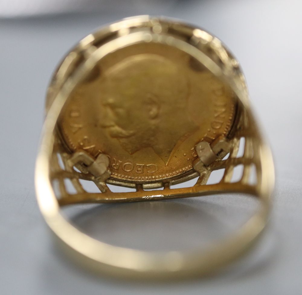 A George V 1925 gold half sovereign, now in 9ct gold ring mount, size V, gross 7.9 grams.